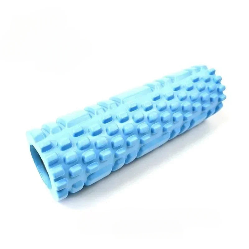 A set of four yoga rollers in black, blue, pink, and purple colors, each featuring a textured surface for muscle activation.